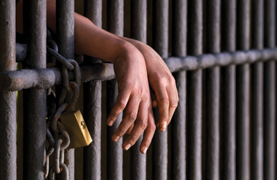 imprisoned-behind-bars